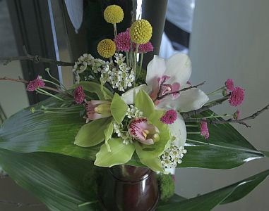 Every day arrangement made of orchid cymbidium craspedia and santini